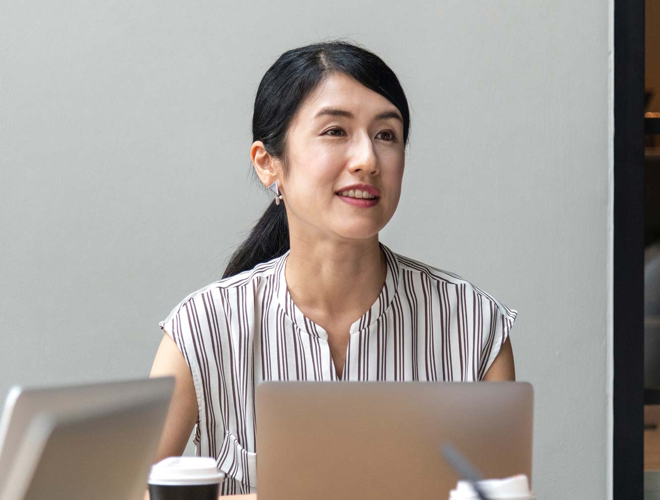 Woman Sitting behind Laptop Woman Sitting behind Laptop